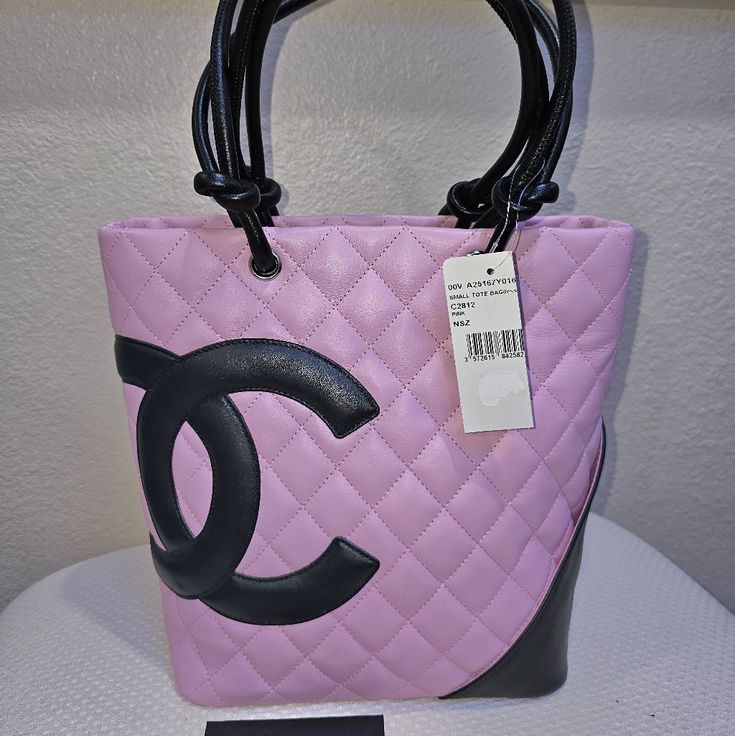 Authentic Chanel Pink Cambon Tote, Purchased Myself And Never Used It. Please See Last Picture Just Shows A Tad The Color Transformed From The Handles To The Back Of This Bag Due To Storage Not Properly. It Doesn't Take Away The Beauty Of It Pink Channel Tote, Designer Pink Bag With Dust Bag, Designer Pink Bags With Dust Bag, Luxury Pink Tote Shoulder Bag, Luxury Pink Shoulder Bag For Shopping, Designer Pink Shoulder Bag For Shopping, Pink Bucket Bag With Dust Bag Included, Designer Pink Bag For Formal Occasions, Pink Evening Bucket Shoulder Bag