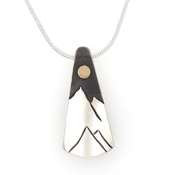 Artist: MTN Surf Designs by Brad Harris Sterling silver with solid 14k gold accents. Oxidized background with a brushed finish. 1" wide x 3/4" long pendant Read Brad Harris' bio here Surf Design, Long Pendant, Gold Accents, Sterling Silver, Pendant, Silver, Gold, Design