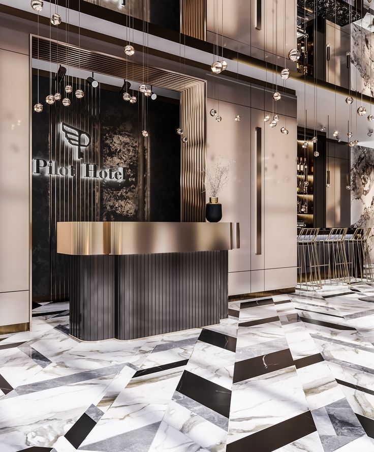 an elegant lobby with marble floors and gold accents