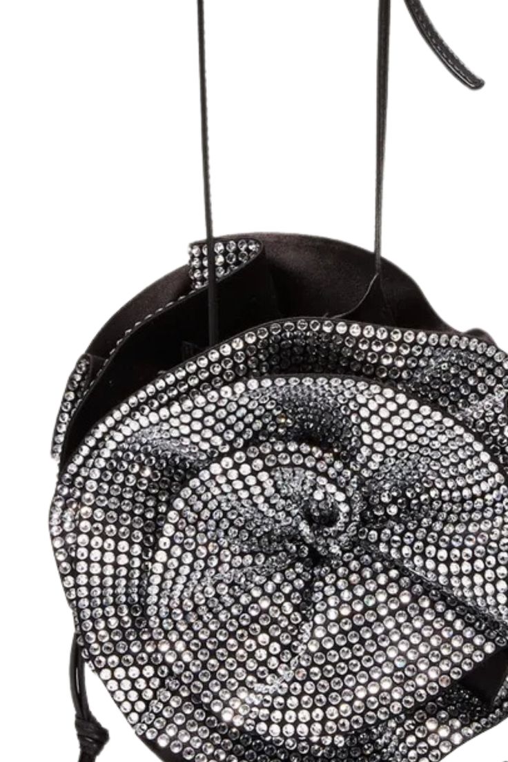 The Magda bag is Magda Butrym's iconic handbag: a bucket bag adorned with large 3D roses on either side of the body, and a leather crossbody strap. The crystal version adds a signature element of Magda DNA through its sparkling, crystal-covered flowers. Exterior: 80% Satin (72% Viscose 28% Silk) 10% Calf Leather 10% Nappa Lamb. Flower 100% Silk. Crystals. All handbags and accessories are considered final sale and may not be returned or exchanged. PLEASE NOTE ALL SALE ITEMS ARE FINAL SALE Party Bucket Bag With Top Carry Handle, Designer Bucket Bag For Party, Luxury Bucket Bag With Top Carry Handle For Party, Modern Crossbody Bucket Bag For Party, Luxury Crossbody Bucket Bag For Party, Party Bucket Bag With Top Handle, Luxury Bucket Bag For Events, Designer Evening Bucket Bag With Top Carry Handle, Designer Bucket Bag With Top Carry Handle For Evening