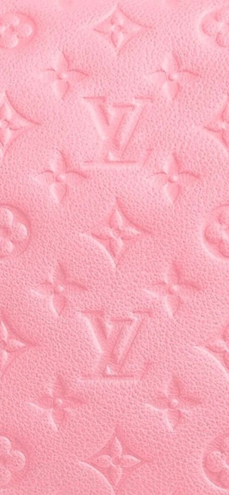 the louis vuitton logo is shown on pink fabric, and it appears to be made