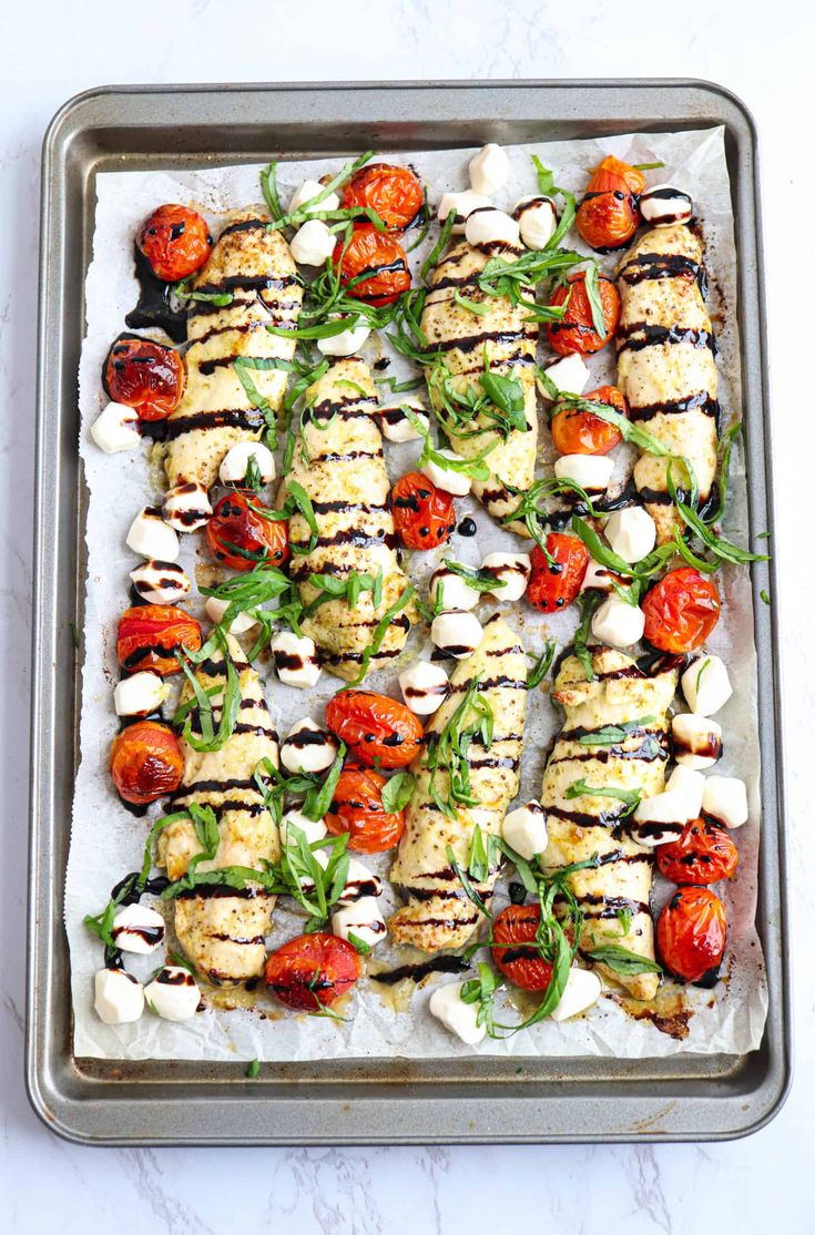 grilled tomatoes and mozzarella on a baking sheet