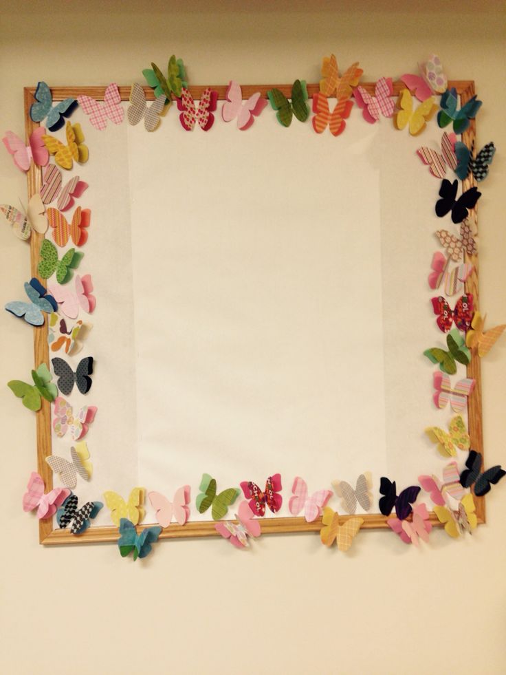 a frame made out of paper with butterflies on it