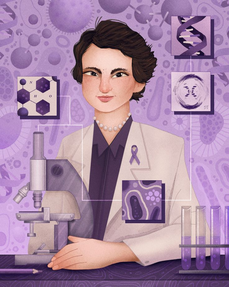 a woman in a lab coat sitting at a table with microscopes and other items