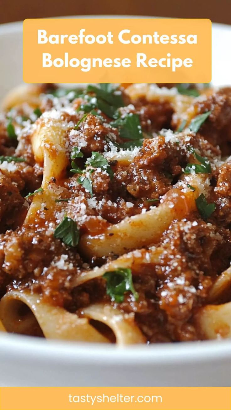 a white bowl filled with pasta covered in sauce and parmesan cheese text reads barefoot contesa bolognaese recipe