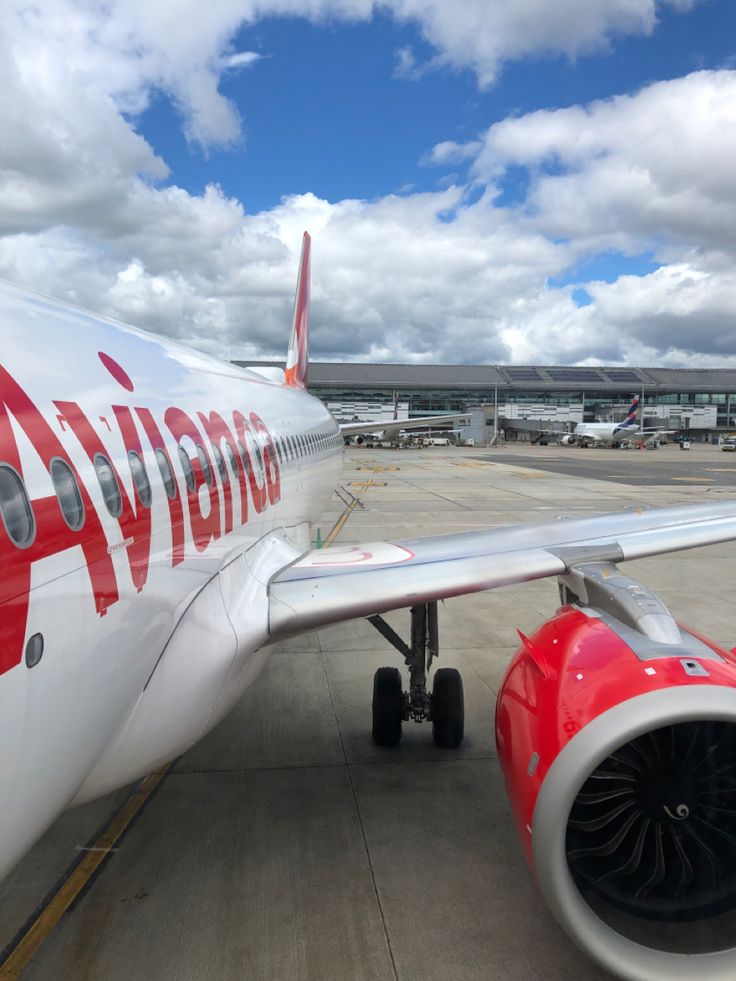 an airplane is parked at the airport with its engine still attached to it's side