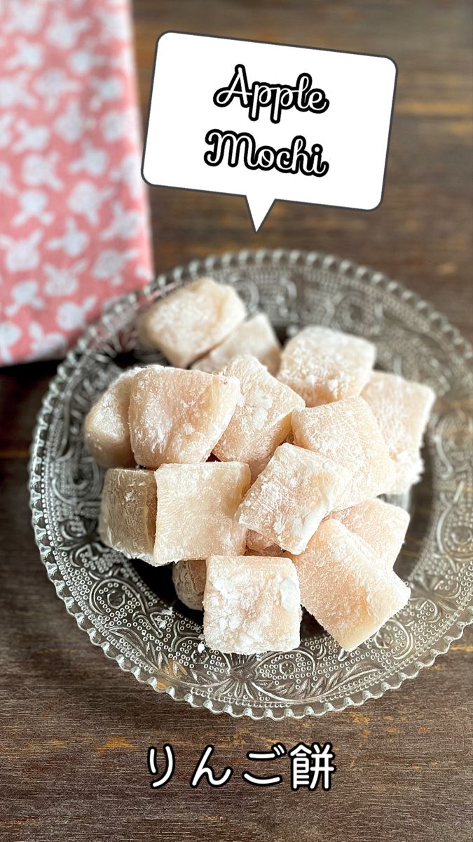 a plate full of sugar cubes sitting on top of a table next to a box