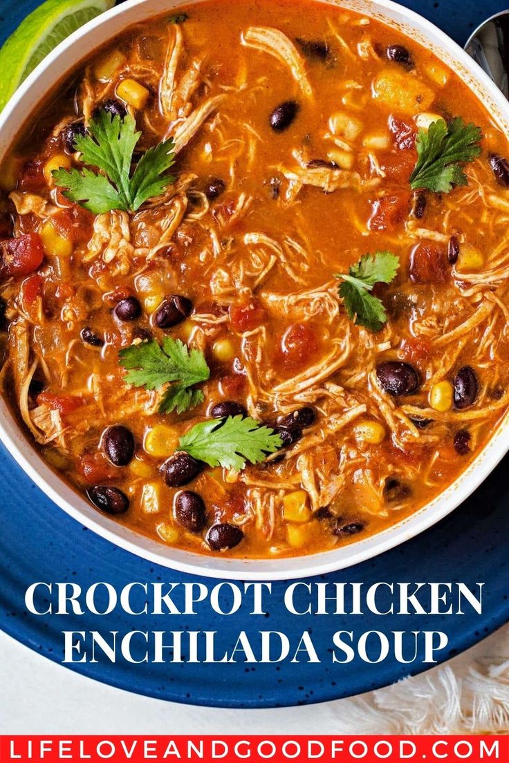 a bowl of crockpot chicken enchilada soup on a blue plate