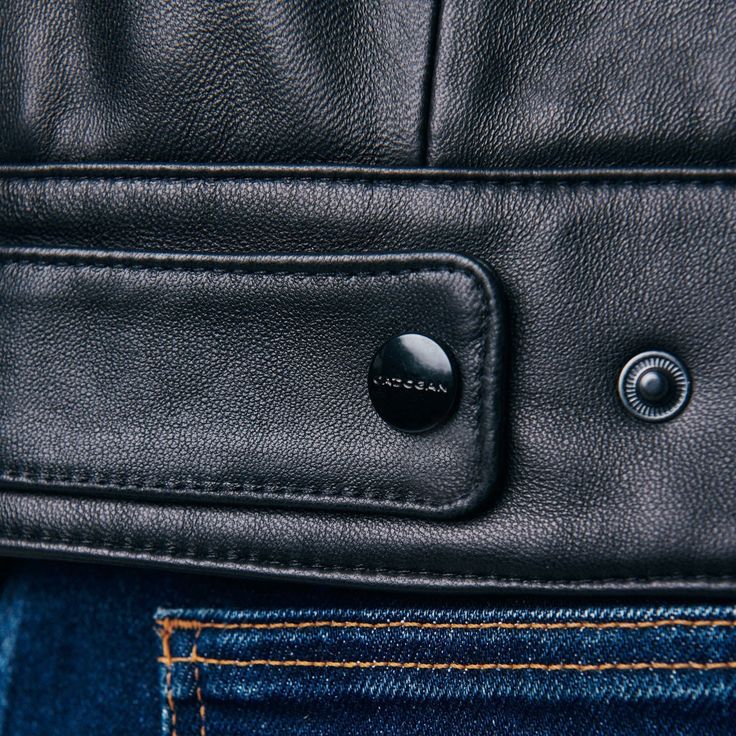 Napa lambskin leather that is 100% full-grain. satin lining in navy blue. Two exterior pockets. shiny, handcrafted titanium hardware in black. Black suede cuffs with zippers. Main zipper extension that is adjustable. Finished by hand stitching.          	Napa lambskin leather that is 100% full-grain.   	Satin lining in navy blue.   	Two exterior pockets.   	Shiny, handcrafted titanium hardware in black.   	Black suede cuffs with zippers.   	Main zipper extension that is adjustable.   	Finis Leather Jacket Outfit Men, Classic Leather Jacket, Cafe Racer Jacket, Titanium Metal, Leather Jacket Outfits, Men's Leather Jacket, Men Formal, Motorcycle Leather, Jacket Outfit