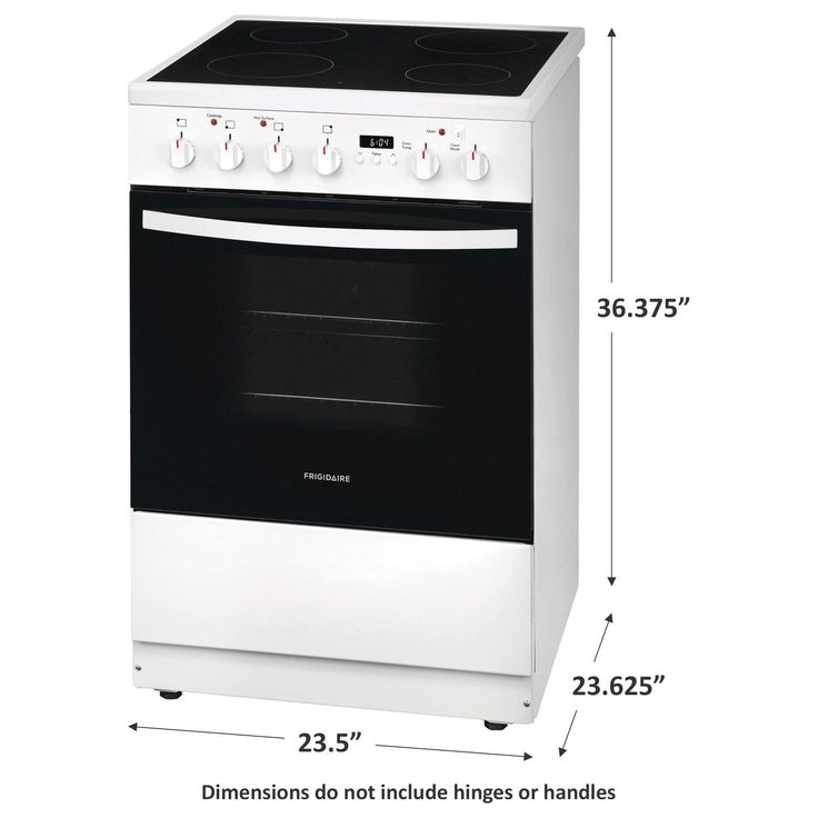 a white and black stove top oven with measurements