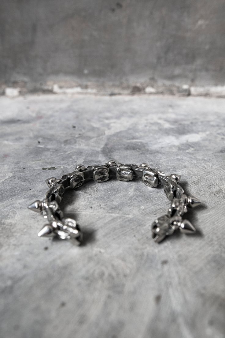 Snake vertebrae cast in metal, set between punk spikes. Made with a unique flexible design, this bracelet can flex to contour around your wrist.This unisex piece fits between a 6.5" on the tightest setting and 8" on the loosest setting.If you need a different size range, specify when ordering. Punk Spikes, Snake Vertebrae, Fanny Pack Purse, Mens Bracelet Silver, White Brass, Metal Bracelet, Mask Shop, Flexible Design, Pocket Belt