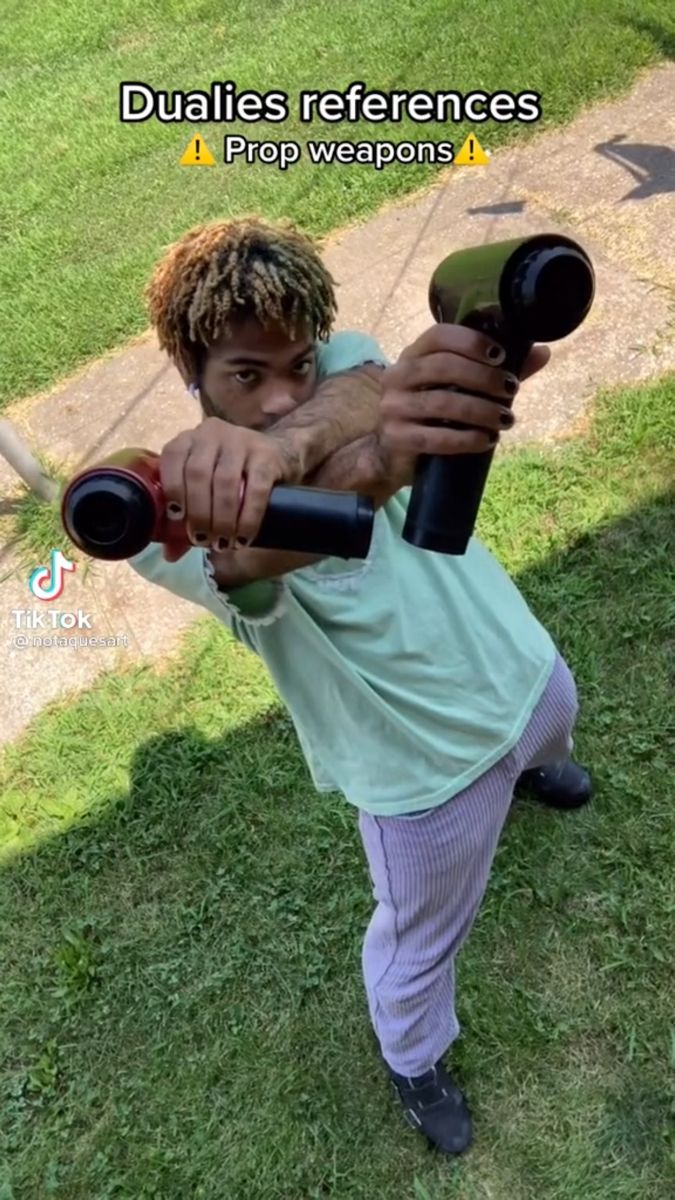 a young man holding a baseball bat in his hand