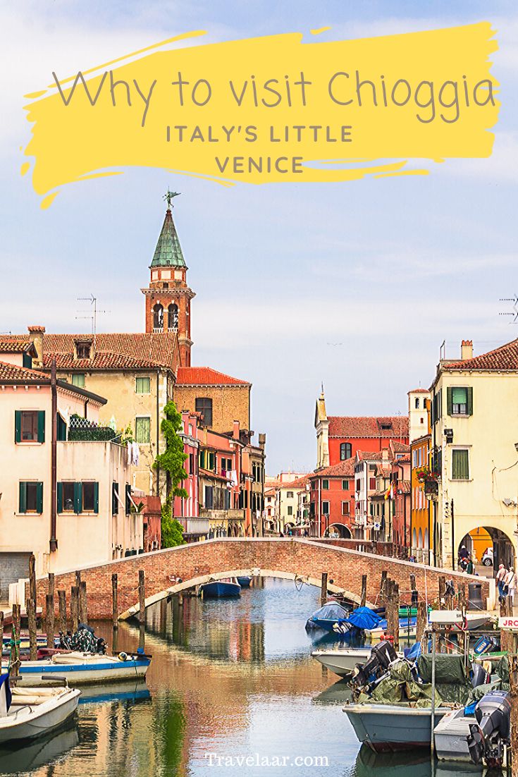 boats are parked on the water in front of buildings and a bridge that reads why to visit chiogia italy's little venice