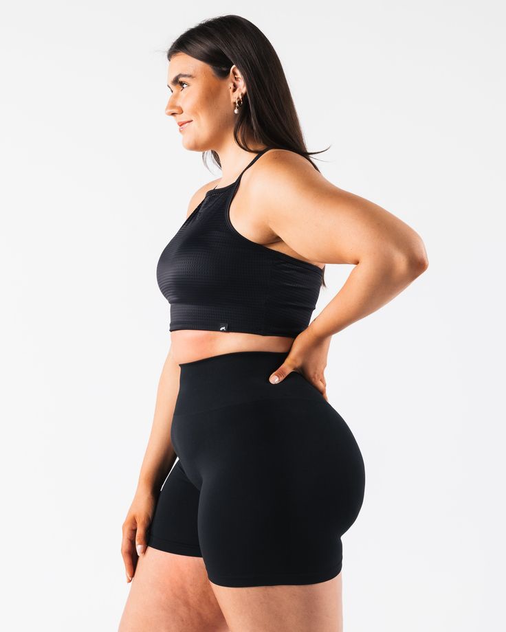 HIGHLIGHTS. Strappy Racer back Breathable mesh Layering FIT SUGGESTION. This item runs true to Alphalete's tight fit... Laura is 5’6”/168cm, wearing a size XS. with 28"/71cm bust. MATERIALS AND WASHING DIRECTIONS. 65% Nylon, 35% Spandex. We recommend washing inside-out on a cold setting. Hang to dry DESCRIPTION This light weight mesh makes for the perfect summer layering piece. Wear it over any of your favorite Alphalete bras for a stylish layer that will help keep you cool in the summer heat. | Workout Activewear With Built-in Bra, Short Length, Compression Activewear With Built-in Bra And Short Length, Versatile Sports Bra With Mesh Back, Fitted Racerback Activewear With Built-in Shorts, Fitted Mesh Back Versatile Activewear, Fitted Sports Bra Short Length, Fitted Versatile Activewear With Mesh Back, Versatile Fitted Activewear With Mesh Back, Black Compression Mesh Sports Bra