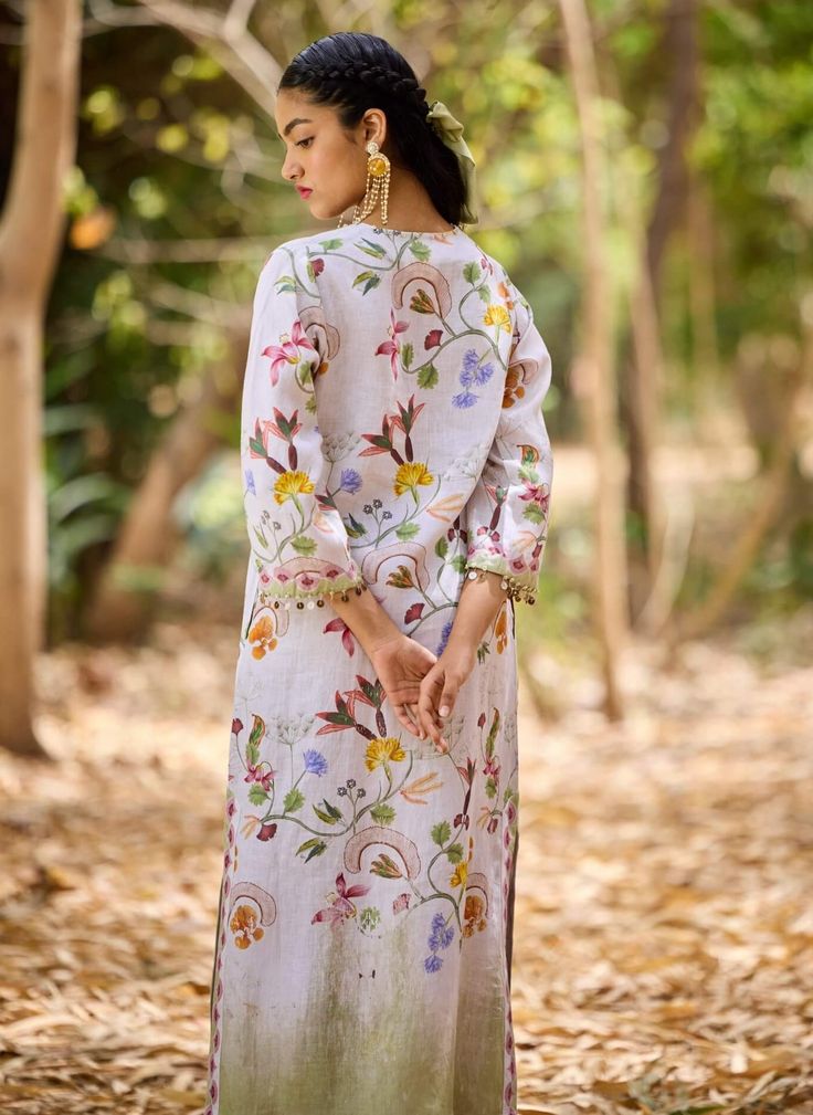 A brand signature, inspired by pozruh travels. The ankle-length printed caftan is characterised by elegance and ease. It is detailed with decorative shell tassels at the neckline and the sleeve cuffs. Multicolor Straight Kurta With Tassels, Elegant Straight Kurta Kaftan For Summer, Summer Straight Kurta With Set-in Sleeves, Elegant Floral Print Tunic Kurta, Bohemian Style Festive Kurta With Digital Print, Bohemian Style Kurta With Digital Print For Festive Season, Traditional Tunic Kurta With Digital Print, Bohemian Digital Print Kurta For Festive Occasions, Traditional Digital Print Tunic Kurta