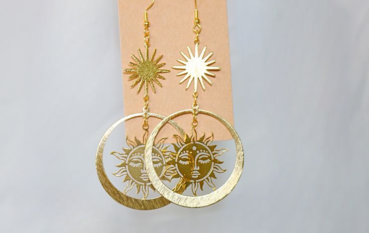 Our Soledad earrings feature a beautiful golden sun design. These earring are made of durable alloy, making them build to last and making them a perfect gift. Handmade Gold Alloy Earrings, Adjustable Gold Earrings For Summer, Handmade Adjustable Alloy Earrings, Gold Sunburst Earrings With Sun Design, Gold Celestial Metal Earrings, Gold Sun-shaped Earrings For Gift, Nickel-free Gold Alloy Hoop Earrings, Gold Sunburst Earrings For Gift, Gold Nickel-free Alloy Earrings