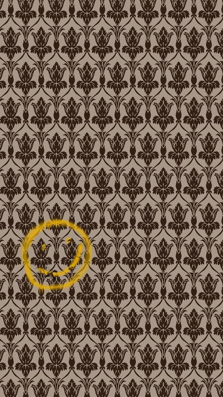 an image of a wallpaper with a smiley face in the center and brown flowers on it