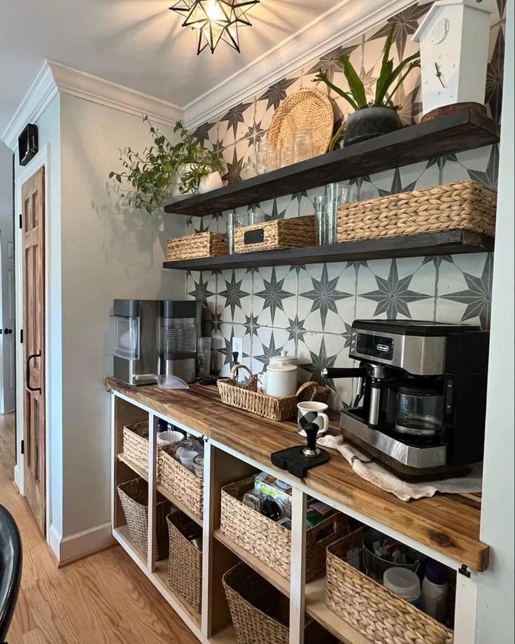 a kitchen area with shelves and baskets on the wall, along with a coffee maker