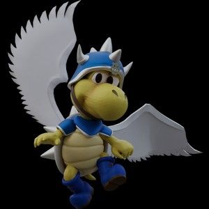 an action figure with wings and a helmet is posed in front of a black background