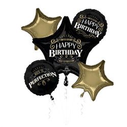 black and gold foil balloons with happy birthday written on the balloon says,'perfection '