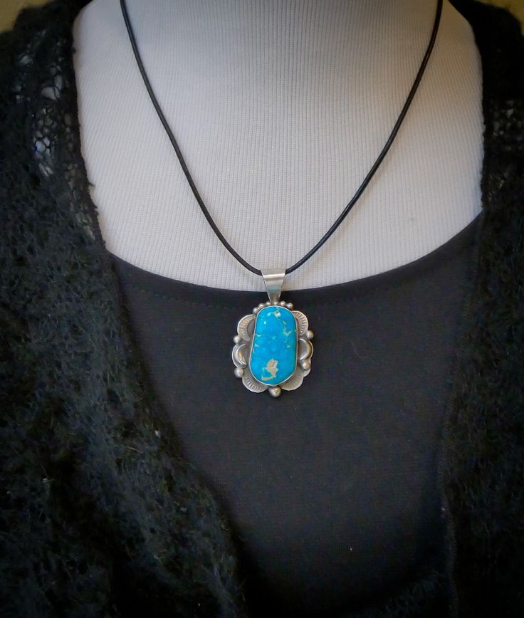 Looking for something extraordinary? This pendant is handcrafted in Sterling Silver and features a breathtaking bright blue Turquoise stone. This is the perfect gift to yourself or someone you love! Measures: 1 3/4 " x 1 1/8" including the bale Bale inside allows for 5 mm or smaller beads or chain Weight: 11 grams Stamped: Sterling Signed: T (Tia Long) Southwestern Style Blue Necklace With Large Pendant, Blue Southwestern Necklace With Large Pendant, Turquoise Necklace With Large Oval Pendant, Turquoise Necklace With Large Oval Stone, Turquoise Necklace With Large Oval Stone Pendant, Blue Gemstone Jewelry With Rectangular Pendant, Southwestern Blue Jewelry With Large Stone, Southwestern Style Blue Jewelry With Large Stone, Southwestern Style Blue Turquoise Necklace As Gift