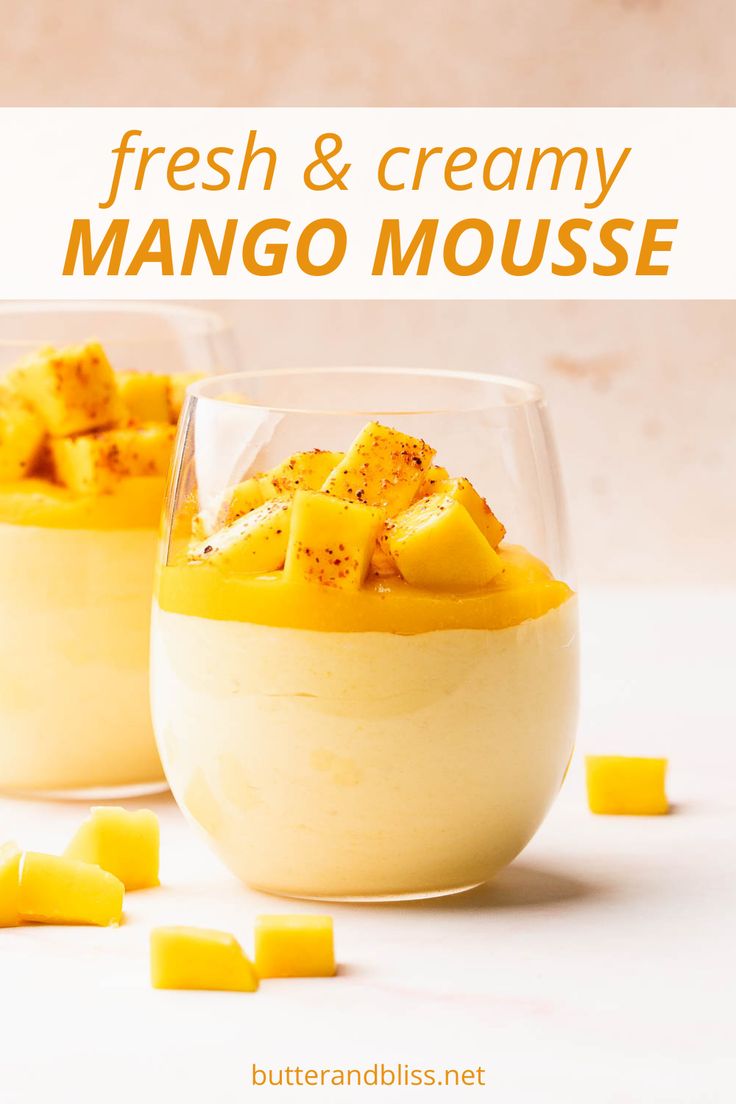 two glasses filled with mango and cream dessert