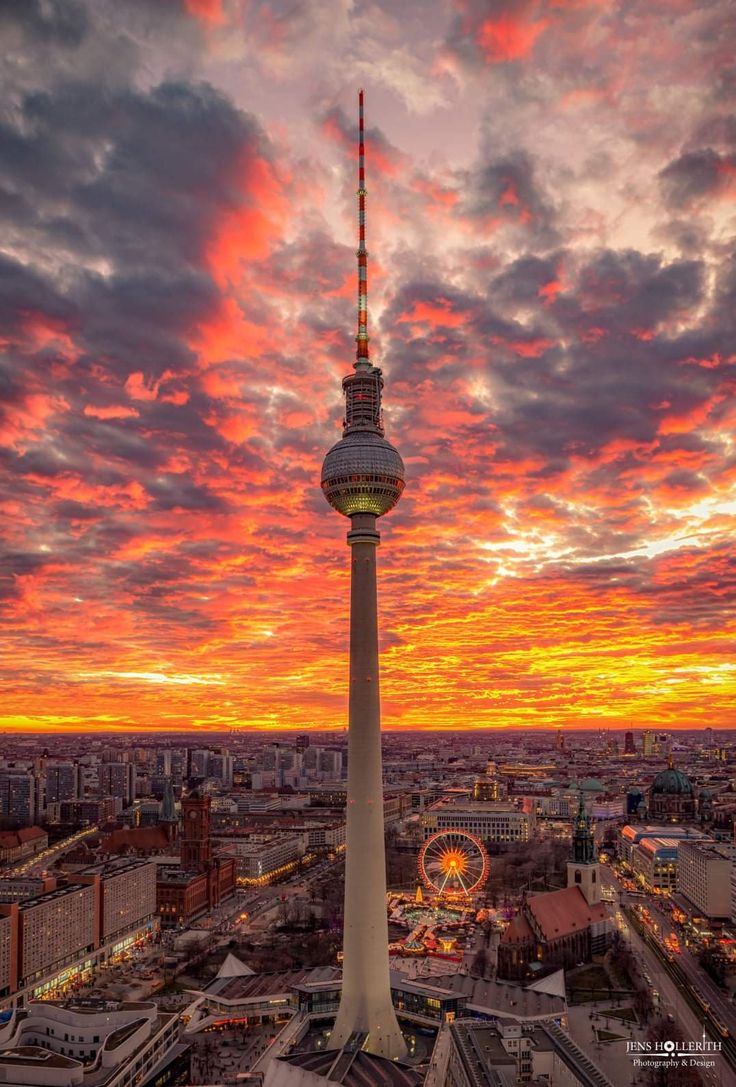 an aerial view of the berlin skyline at sunset