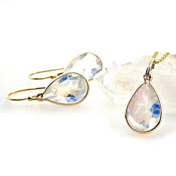 A simple moonstone pendant with a beautiful pear-shaped moonstone. Bezel set in either 14 karat Yellow Gold or in a Sterling Silver bezel. Genuine Moonstone Oval, Faceted Clear with a beautiful blue, purple or rainbow glow - colors vary AA+ quality Made to order - Production time is 2-4 days :: select your moonstone size 7 x 5 mm :: select Yellow Gold OR Sterling Silver Chain sold separately, please message us for details. Made in Los Angeles, CA Teardrop Moonstone Jewelry In Yellow Gold, Yellow Gold Teardrop Moonstone Jewelry, Moonstone Teardrop Jewelry For Everyday, Everyday Teardrop Moonstone Jewelry, Minimalist Moonstone Teardrop Jewelry, Minimalist Teardrop Moonstone Jewelry, White Pear-shaped Moonstone Jewelry, March Birthstone Necklace, Black Diamond Necklace