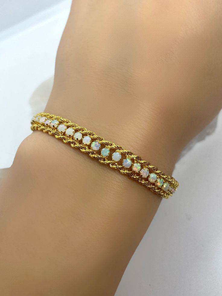 Opal Bracelet, Gemstone Bracelet, Gold Bracelet, Birthstone Bracelet, Chain Bracelet, Rope 14k Chain Bracelet, Jewelry 14k 18k, Jewelry Gift *100% natural gemstone *14k-18k solid gold *solid gold (NOT plated) *gemstone : opal *gemstone opal: 2.75 mm. *stone shape: round *stones opal: 55 pcs. Formal Yellow Gold Chain Bracelet With Gemstone, Formal Yellow Gold Gemstone Chain Bracelet, Anniversary Jubilee Yellow Gold Beaded Bracelet, Gold Plated Jubilee Tennis Bracelet, Adjustable Yellow Gold Crystal Bracelet For Formal Occasions, White 14k Gold Jubilee Bracelet, Yellow Gold Jubilee Crystal Bracelet Gift, Formal Yellow Gold Bangle Crystal Bracelet, Gold Gemstone Tennis Bangle Bracelet