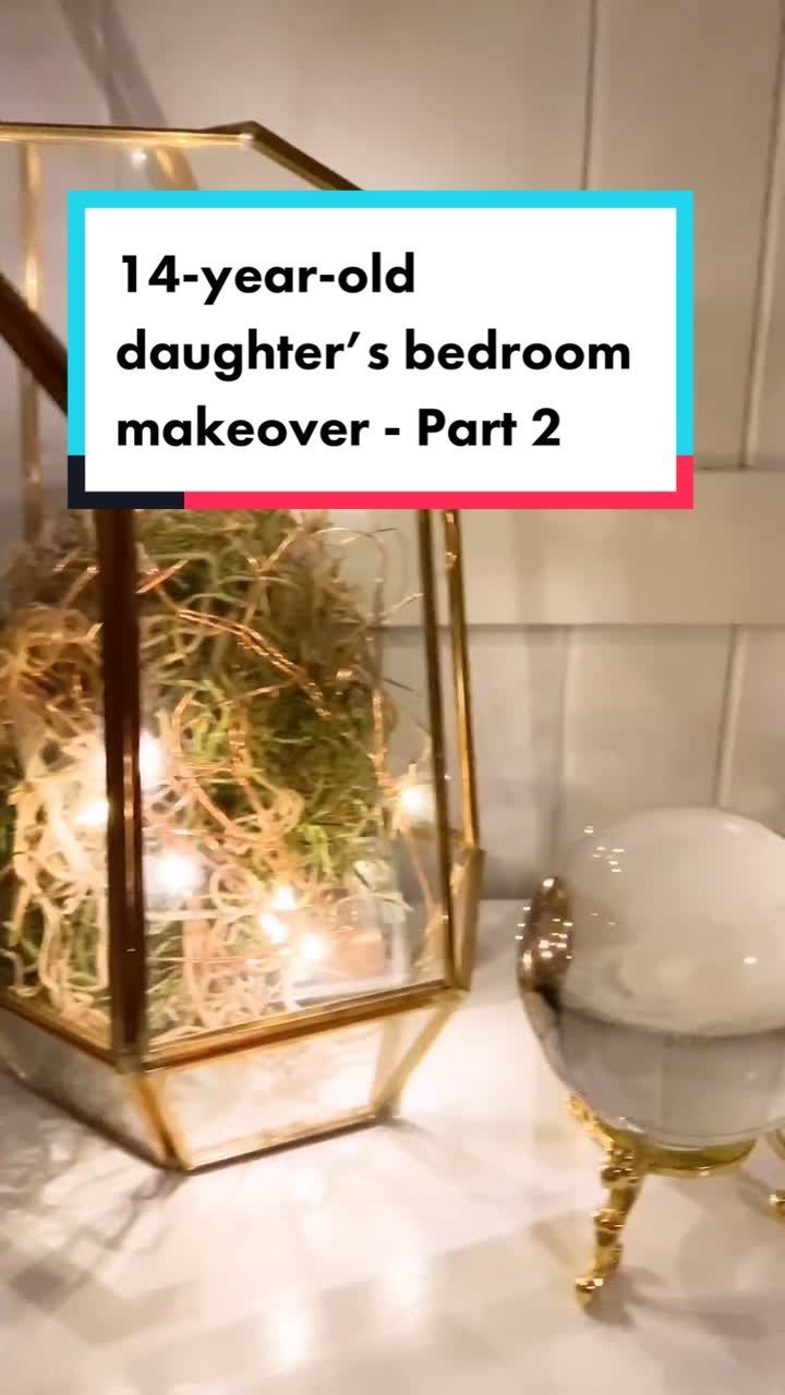 a glass box filled with plants sitting on top of a counter next to a bowl