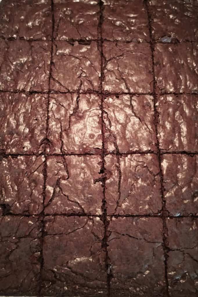 chocolate brownies cut into squares on top of each other