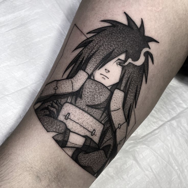 a black and white tattoo on the leg of a person with an anime character design