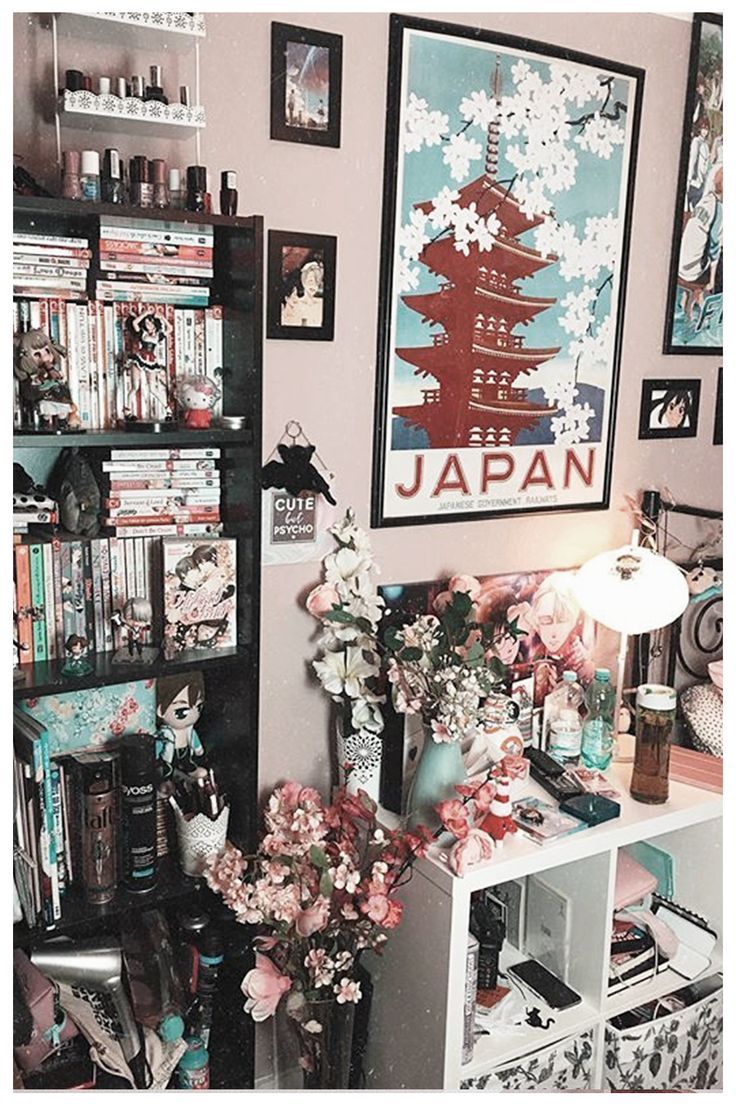 a living room filled with lots of furniture and bookshelves covered in art work