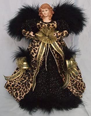 a figurine is dressed in leopard print and black fur, with gold accents