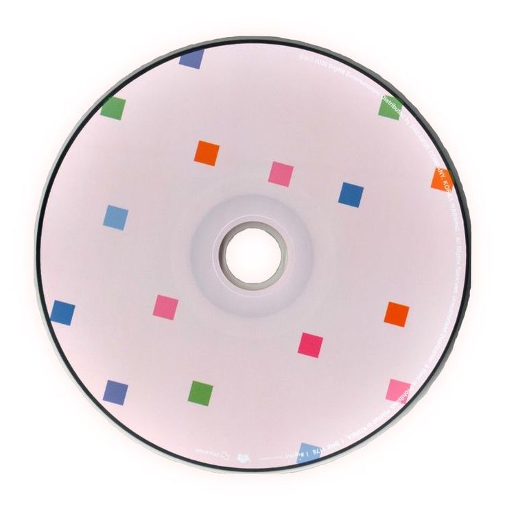 a white disc with multicolored squares and dots on the side, sitting in front of a white background