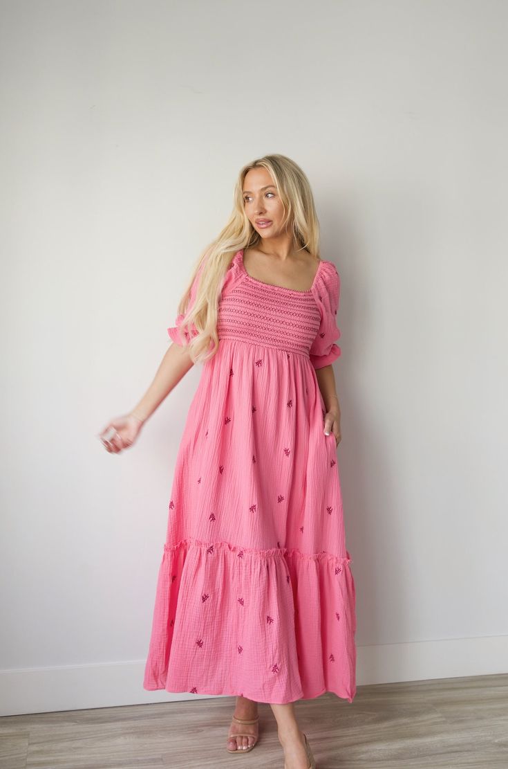 Discover a perfect blend of style and comfort with our Embroidered Gauze Midi Dress in Pink. The lightweight gauze fabric is adorned with delicate floral embroidery and a bold dark pink contrast, making it perfect for any occasion. The smocked waist adds a flattering fit and the midi length offers versatility for all body types. Embrace the hot pink hue and make a statement with this beautiful dress. gauzy cotton smocked bodice elbow length sleeves side pockets embroidered lined midi/maxi length Pink Wedding Guest Dress, Curvy Date Night Outfit, Simple Frock, Air Clothes, Mom Outfits Fall, Simple Frock Design, Pink Contrast, Simple Frocks, Bright Dress