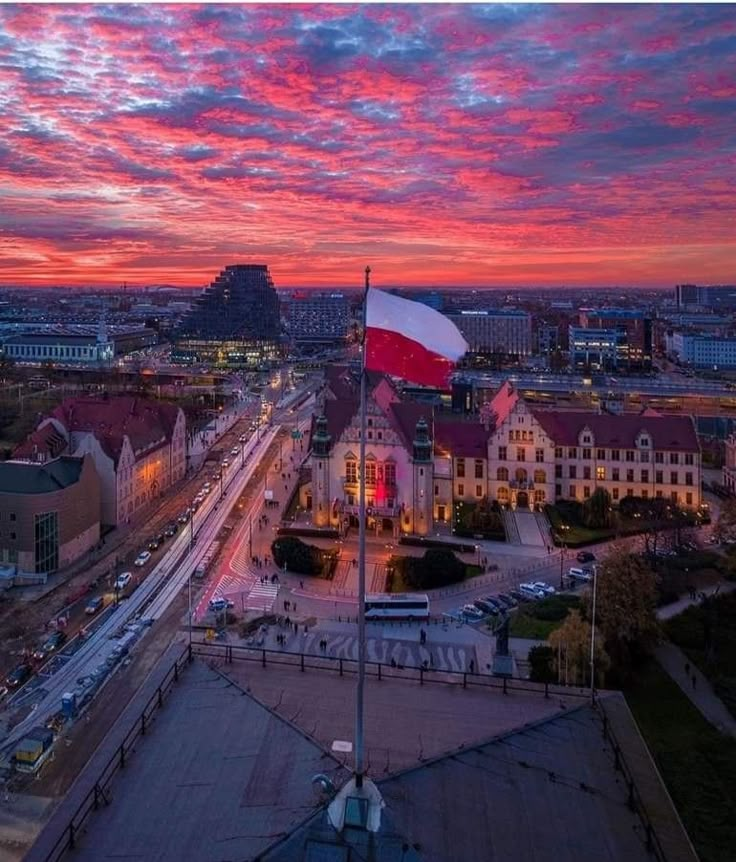 an aerial view of a city at sunset