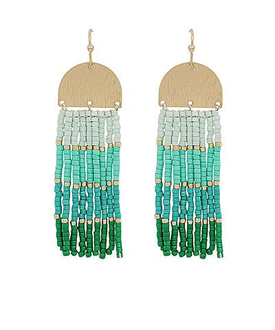 two tone earrings with beads and tassels on the sides, one in green and white