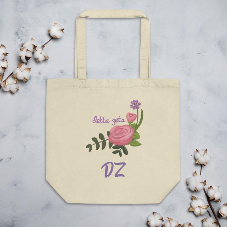 Your Delta Zeta Pink Killarney Rose tote bag is a classic choice and the perfect companion for wherever your adventures take you. It features 100% certified organic cotton that has been lovingly printed on one side with our very own, artist-designed Delta Zeta Pink Killarney Rose ay pattern and the letters "DZ." It comes in either black or natural and is perfect for traipsing around campus, shopping around town, or a fun day at the beach! Your Delta Zeta tote holds up to 30 pounds of your person Rose Tote Bag, Shopping Totes, Your Person, Happy Notes, Delta Zeta, Killarney, Fun Day, Rose Design, Black Tote Bag