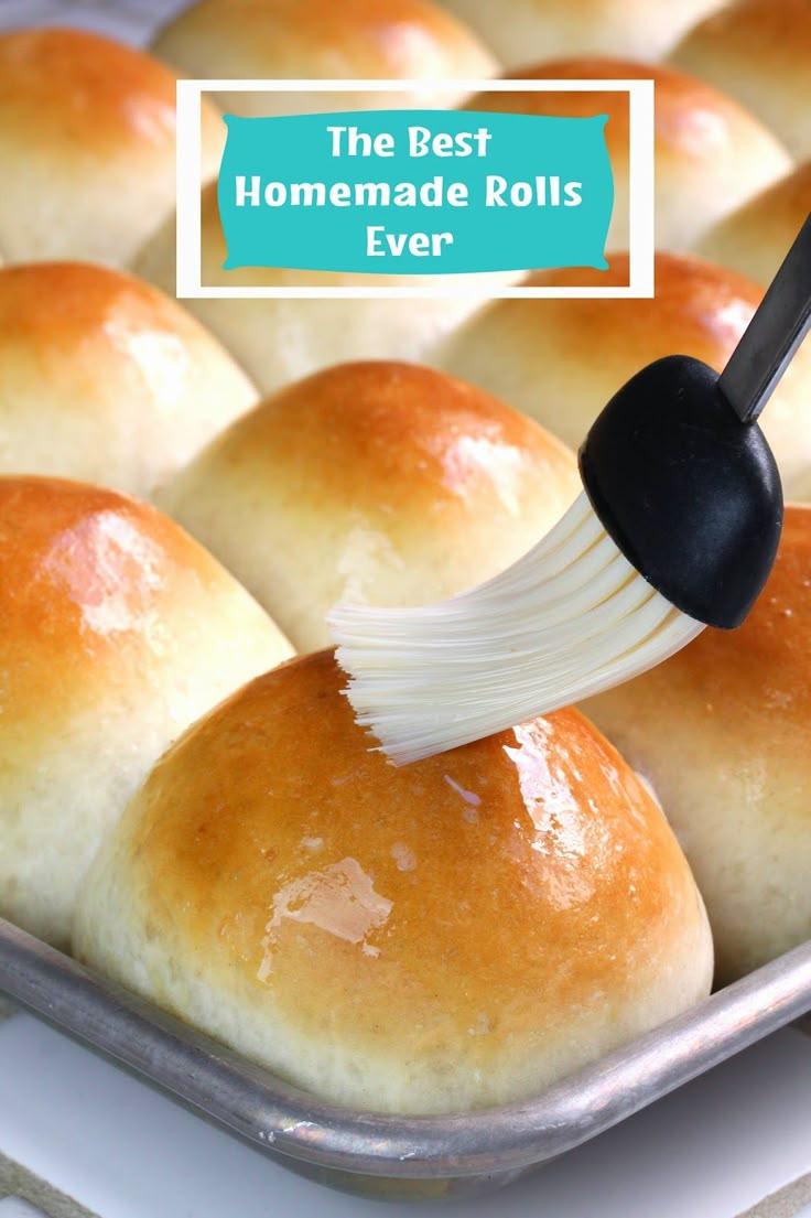 the best homemade rolls ever is being drizzled with butter