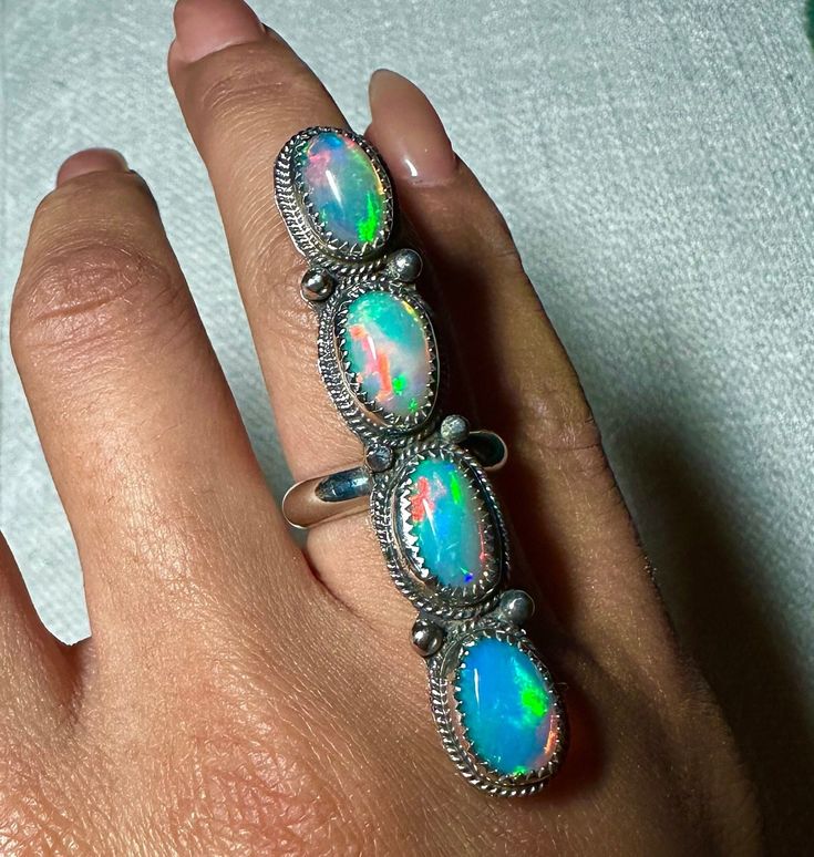 Genuine, natural, high-grade Ethiopian Welo opals!  Solid 925 sterling silver  Artisan/Silversmithed in California  Size 6 Other sizes available for preorder Silver Multi-stone Ethiopian Opal Jewelry, Silver Ethiopian Opal Ring With Cabochon, Unique Hallmarked Sterling Silver Opal Ring, Silver Opal Ring With Polished Finish, Unique Silver Opal Ring With Multi-stone, Artisan Silver Opal Ring With Multi-stone, Spiritual Silver Opal Ring With Multi-stone, Oval Multi-stone Opal Ring In Sterling Silver, Oval Opal Ring Stamped 925