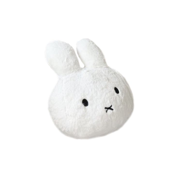 a white stuffed animal with black eyes and ears on it's head, sitting in front of a white background