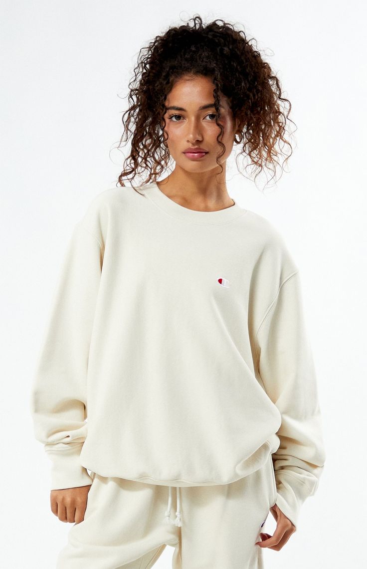 PacSun exclusive! Elevate your casual wardrobe with the Champion x PAC 1980 Crew Neck Sweatshirt, designed with ribbed side panels for a sleek silhouette. Featuring a classic crew neckline, a Pacific Sunwear 1980 soft-touch back graphic, and the iconic Champion "C" embroidery at the left chest, this sweatshirt effortlessly combines comfort and style for a timeless look.


	Solid color sweatshirt
	Long sleeves
	Crew neckline
	Champion C embroidery
	PacSun back graphic
	Ribbed side panels
	Ribbed trimming
	82% cotton, 18% polyester
	Machine washable
	Model is wearing a size medium
	Model measurements: 5’6” height, 30” bust, 25.5” waist, 36.5” hip Champion Clothing, Pullovers Outfit, Just Style, Champion Sweatshirt, Sweatshirt Outfit, Women Hoodies Sweatshirts, White Sweatshirt, Casual Wardrobe, Who What Wear