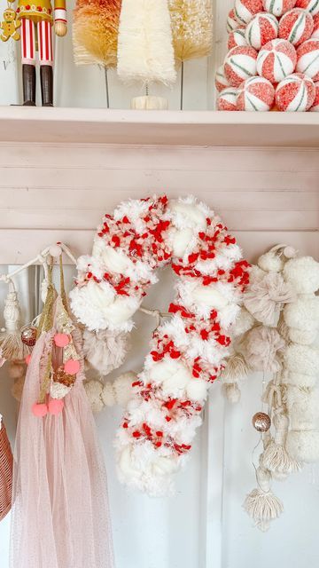 a shelf filled with candy canes and wreaths