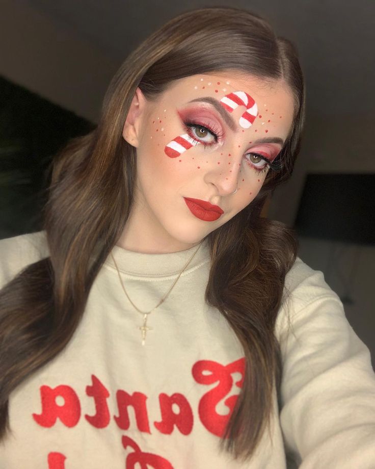 Candy cane makeup Christmas Candy Cane Spirit Day Outfit, Candy Cane Makeup Look, Santa Makeup Christmas, Diy Candy Cane Costume, Dress Like A Candy Cane Day At School, Crazy Christmas Makeup, Candy Cane Makeup Ideas, Dress Like A Candy Cane, Candy Cane Face Paint