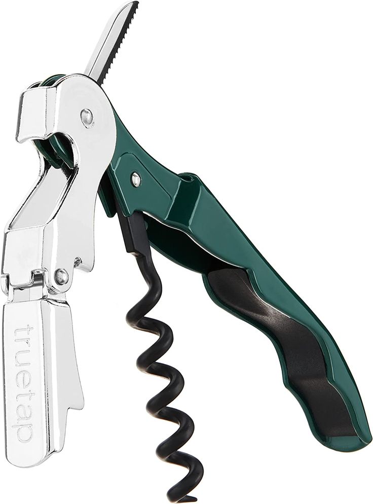 a green scissor that is open on top of a white background