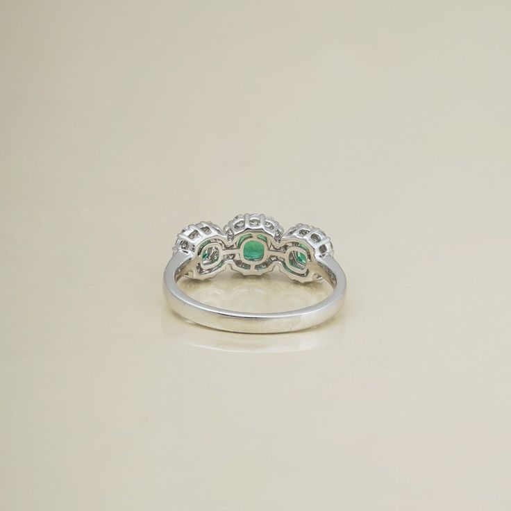 Gold(14K) : 3.13gDiamonds : (VS clarity & H-I colour): (Brilliant cut ) : 0.39ctGemstone : Emerald : 0.79ctNeed help in finding your size? Refer to our Size chart Diamond White Emerald Ring With Halo Setting For Anniversary, Anniversary Emerald Ring With Diamond White Halo Setting, Three Stone Platinum Round Rings, Platinum Three Stone Round Rings, Sterling Silver Emerald Ring With Vvs Clarity, Promise Emerald Ring With Diamond, Heirloom Three Stone Round Rings, Diamond Rings With Emerald For May Birthstone, Diamond White Emerald Ring For Anniversary