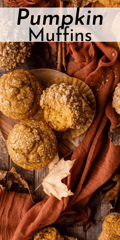 pumpkin muffins on a wooden table with autumn leaves