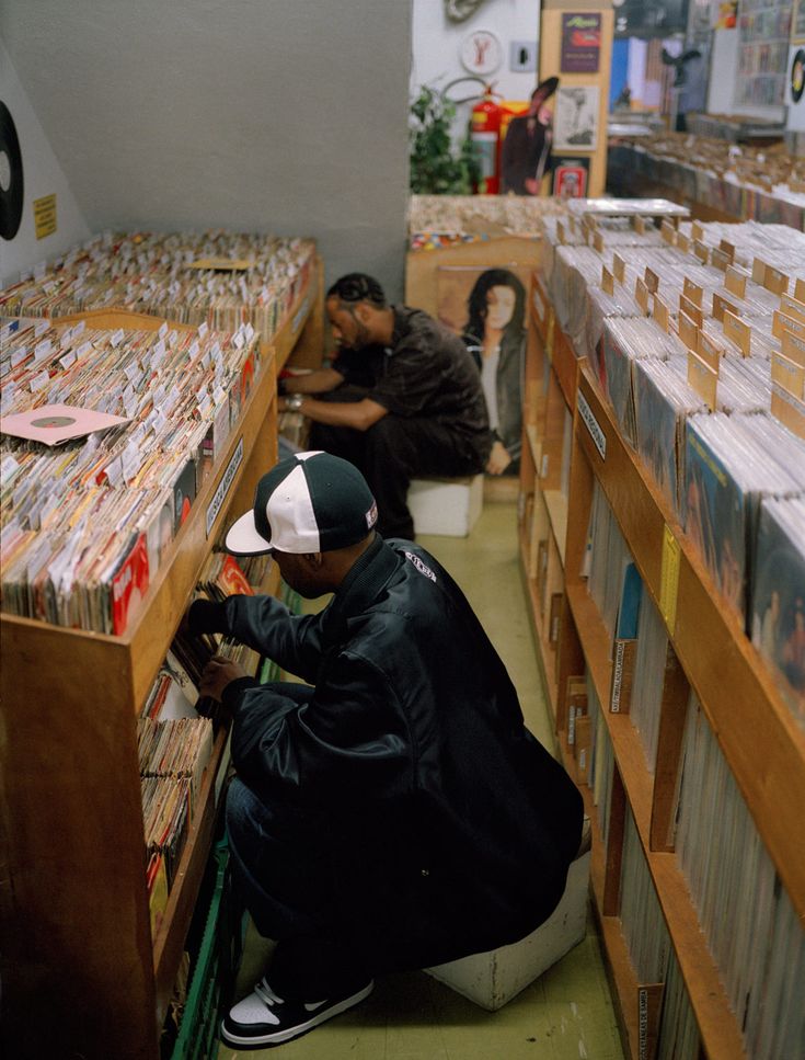 two people in a record store looking at records