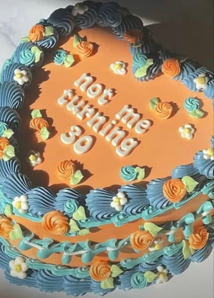 a birthday cake with the words happy birthday written on it in frosting and flowers